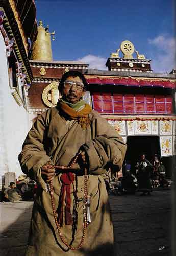 
Pilgrim outside Jokhang Temple in Lhasa - Trekking in Tibet: A Traveler's Guide book
